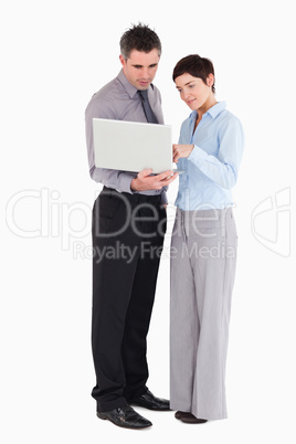 Office workers using a laptop