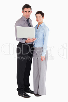 Office workers holding a laptop