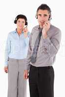 Portrait of coworkers using headsets