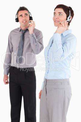 Portrait of managers using headsets