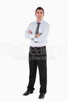 Businessman standing up with his arms crossed