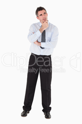 Thoughtful businessman with his hand on his chin