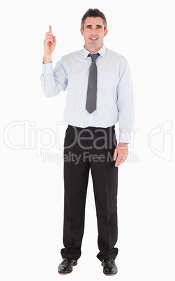 Businessman pointing at copy space