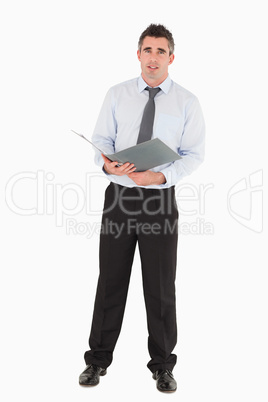 Businessman holding a binder