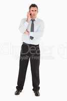 Angry businessman using a mobile phone