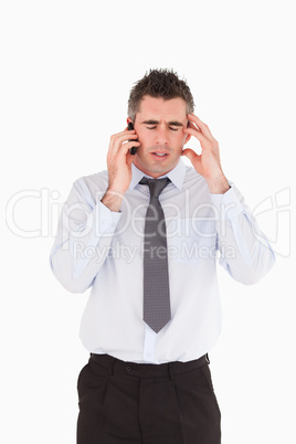 Portrait of a depressed man making a phone call