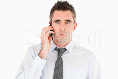 Unhappy man making a phone call