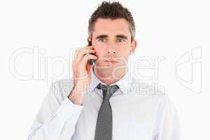 Unhappy man making a phone call