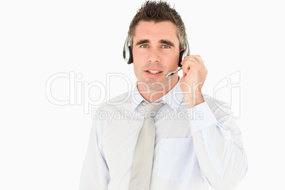 Male secretary speaking through a headset