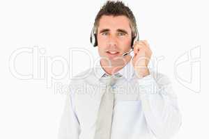 Male secretary speaking through a headset