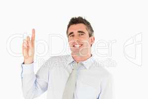 Smiling businessman pointing at copy space