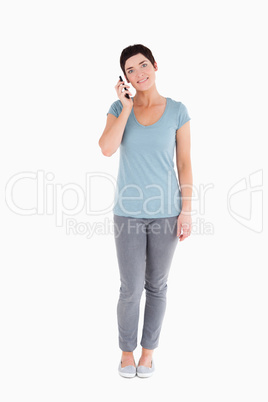 Smiling woman calling with a mobile phone