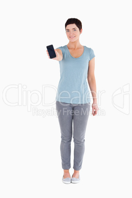 Smiling woman showing a smartphone