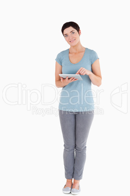 Dark-haired woman using a tablet computer