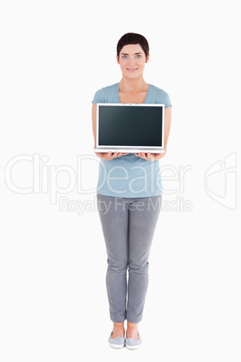 Portrait of a woman showing a notebook