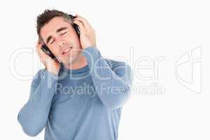 Handsome man listening to music