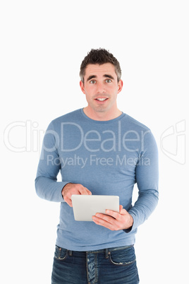 Portrait of a man holding a tablet computer