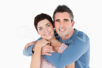 Man embracing his wife