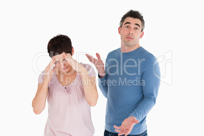 Wife crying while her husband is wondering why