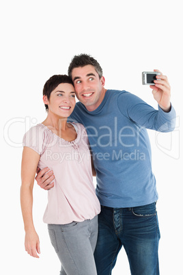 Portrait of a couple taking a picture of themselves
