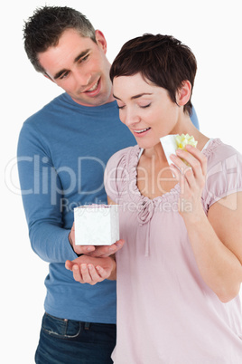 Portrait of a husband surprising his wife with a present