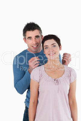 Handsome man offering a necklace to his wife