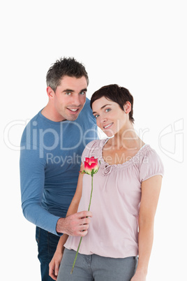 Man offering a rose to his wife