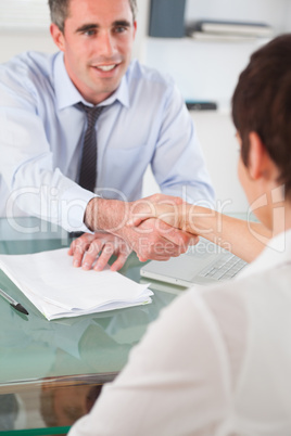 Portrait of a manager and an applicant having a handshake