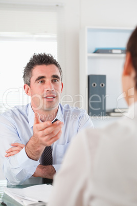 Portrait of a manager talking to a candidate