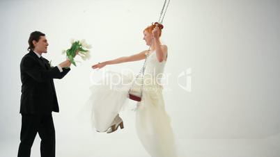 Bride and groom on the swings