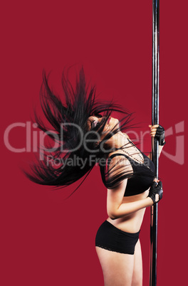 Young girl in pole dance with black hair