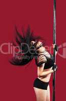 Young girl in pole dance with black hair