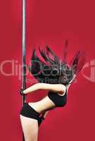 Woman in lingerie pole dance with black hair