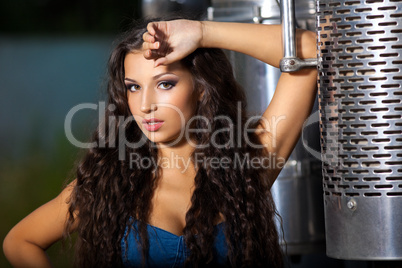 Young pretty girl portrait near steel truck