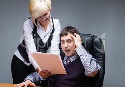 Businesspeople reading documents