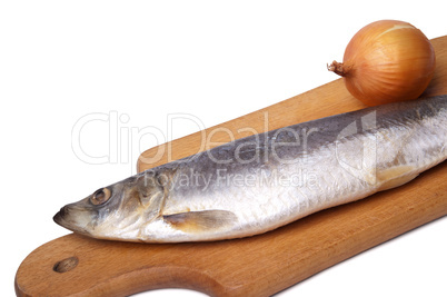 Herring and onion on kitchen board