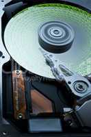 hard disk with green data on platter -aah-