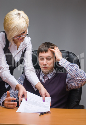 Businesspeople reading documents