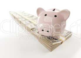 Pink Piggy Bank on Row of Money