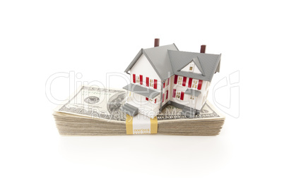 Small House on Stack of Hundred Dollar Bills