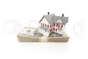 Small House on Stack of Hundred Dollar Bills