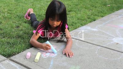 Little Girl Creating Sidewalk Art