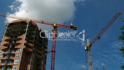 Construction crane working against the blue sky