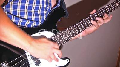 playing at electric guitar