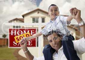 Hispanic Father and Son in Front of House, Sold Sign