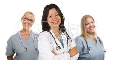 Hispanic Female Doctor and Colleagues Behind