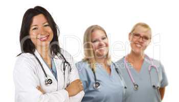 Hispanic Female Doctor and Colleagues Behind