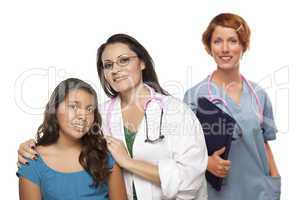 Hispanic Female Doctor with Child Patient and Colleague Behind
