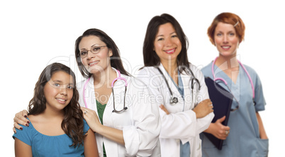 Hispanic Female Doctor with Child Patient and Colleagues Behind