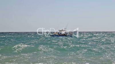 Motor boat on sea waves